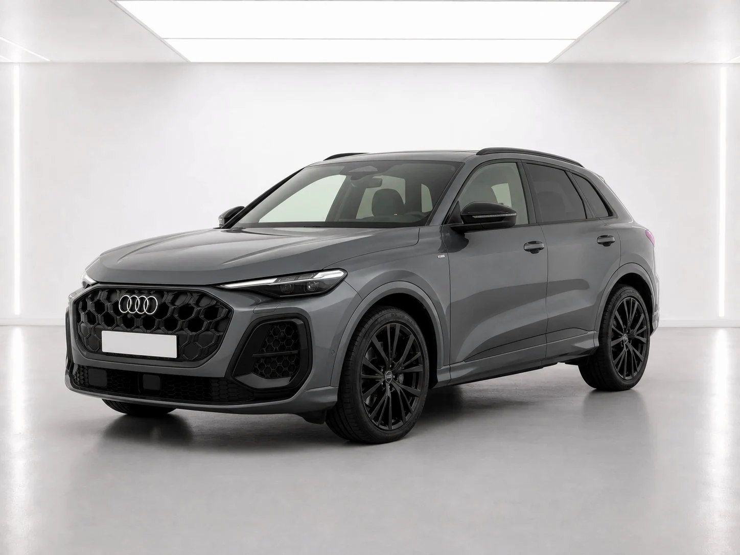 2026 Audi Q5 Black Edition e-hybrid in a white LED showroom