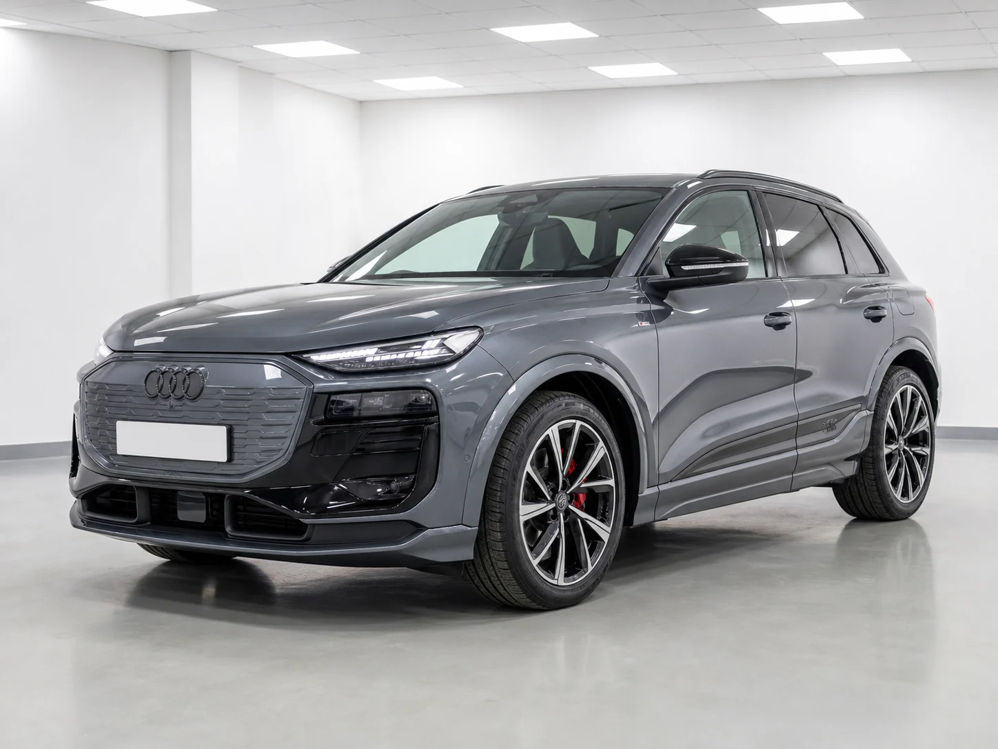 2026 Audi Q6 e-tron quattro S line in a white LED showroom