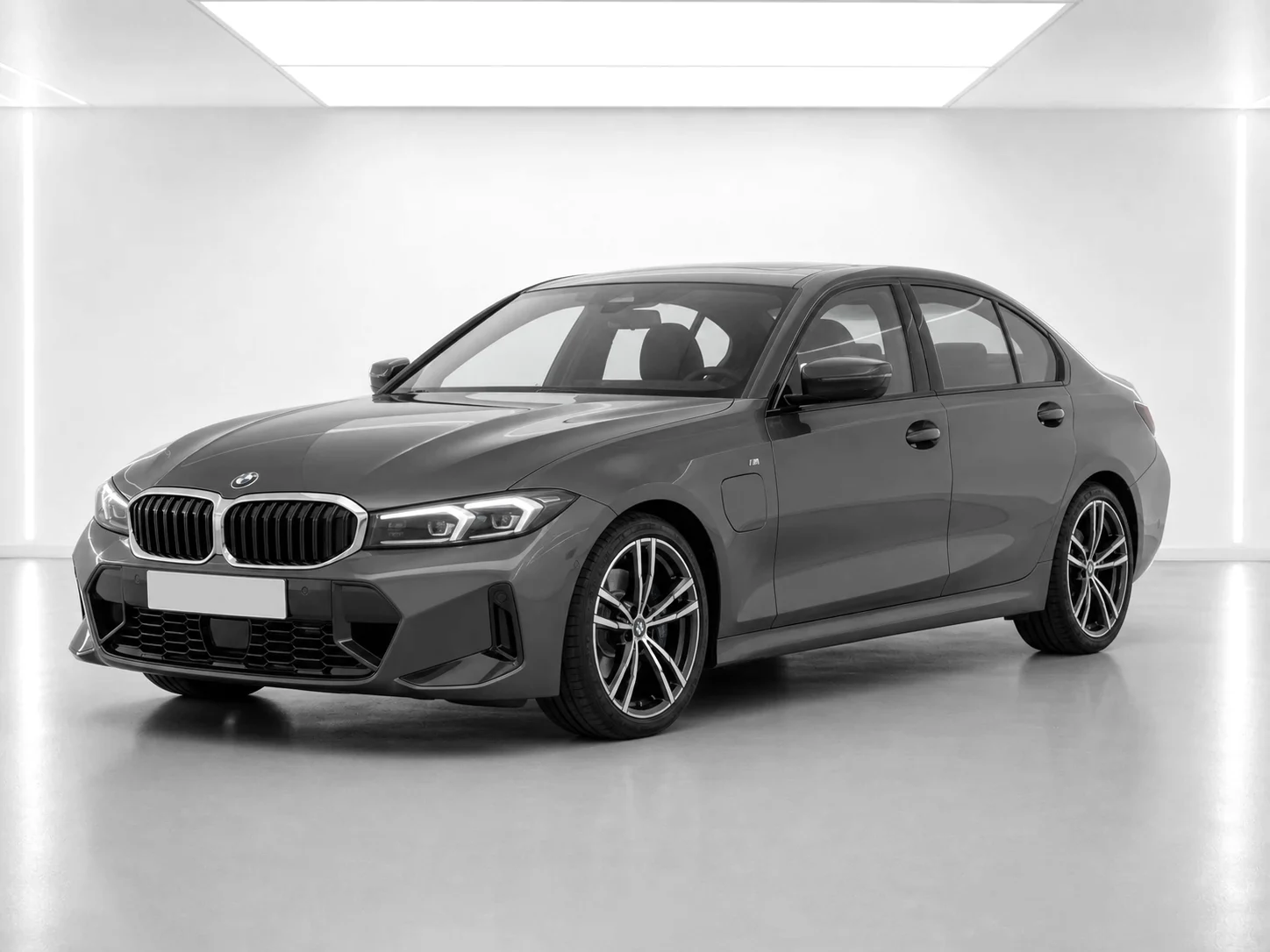 2026 BMW 3 Series 330e M Sport in a white LED showroom