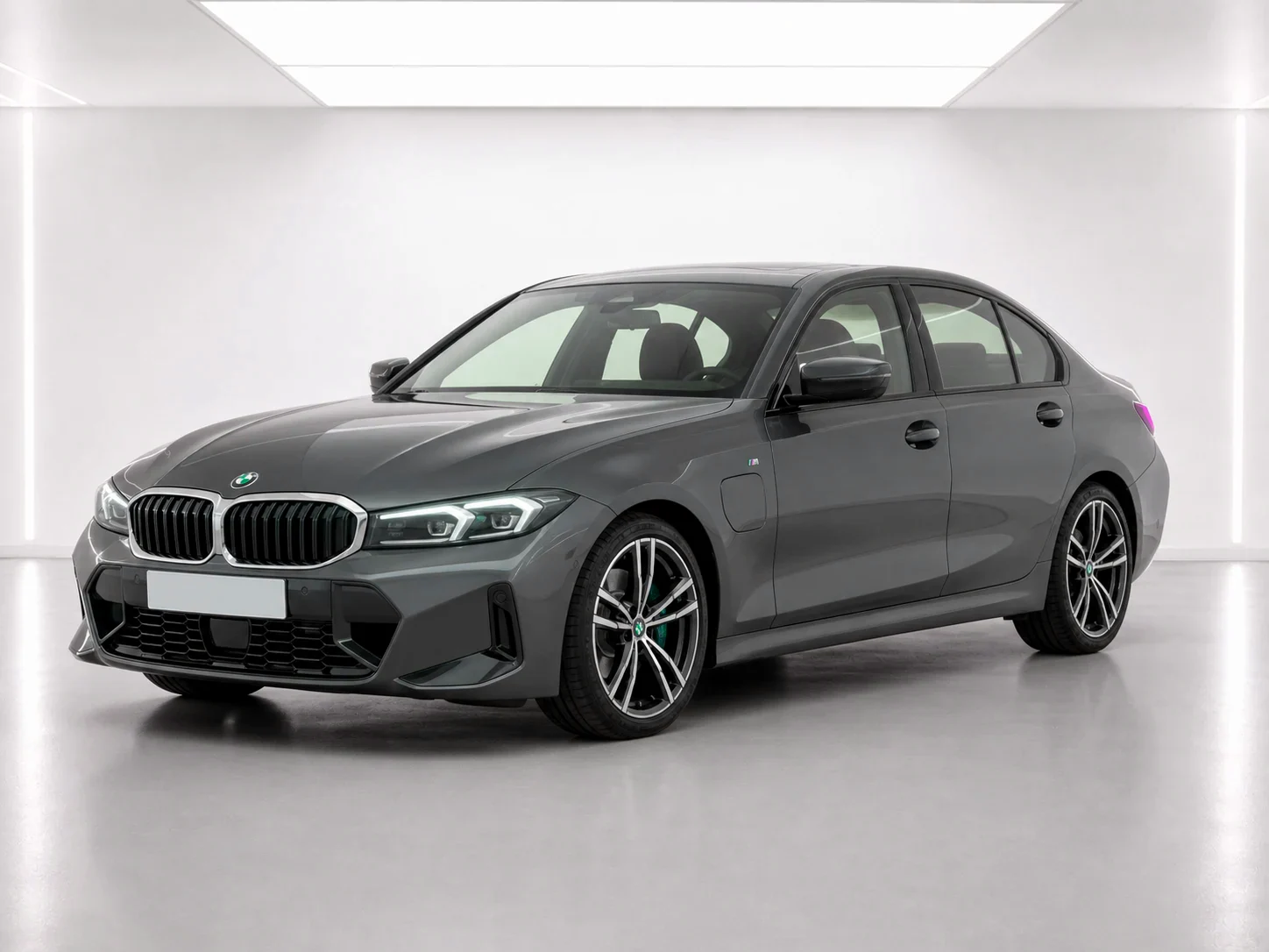 2026 BMW 3 Series 330e M Sport in a white LED showroom