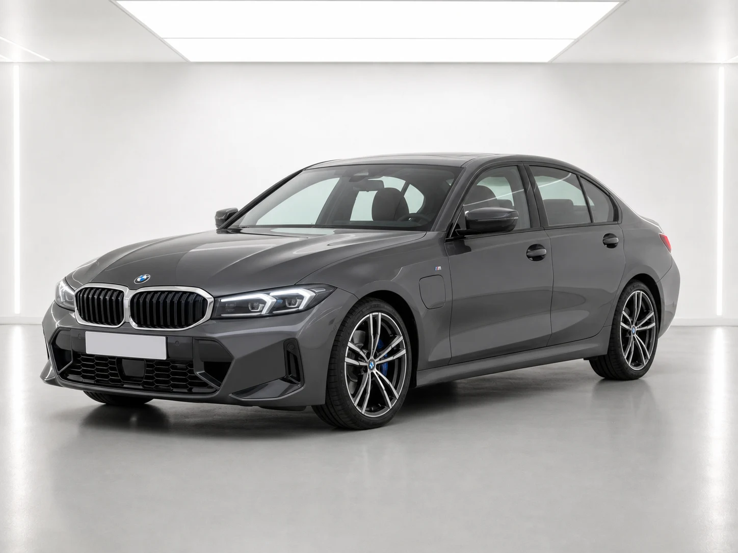 2026 BMW 3 Series 330e M Sport in a white LED showroom