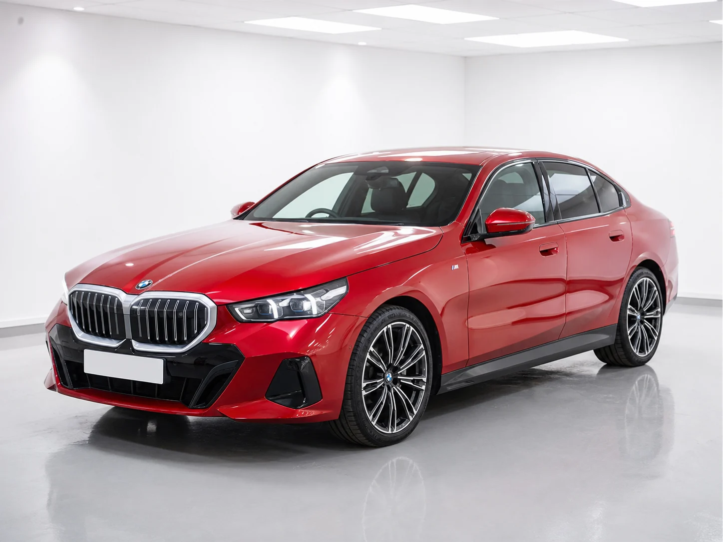 2026 BMW 5 Series 520i M Sport in a white LED showroom