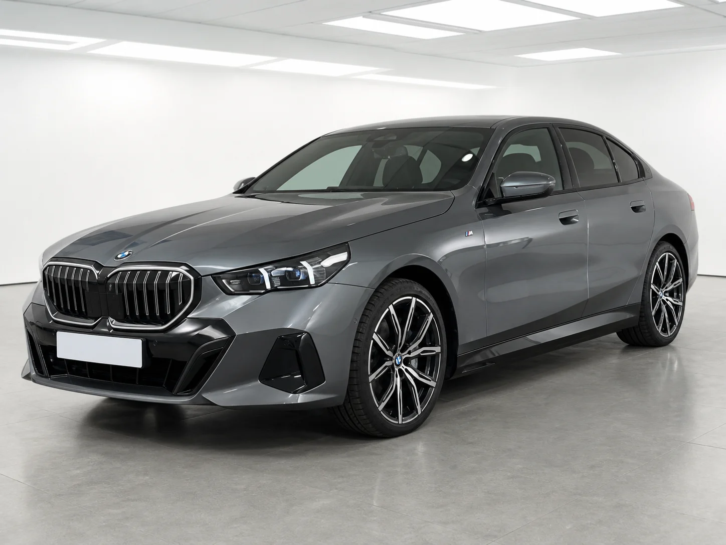 2026 BMW i5 eDrive40 M Sport in a white LED showroom