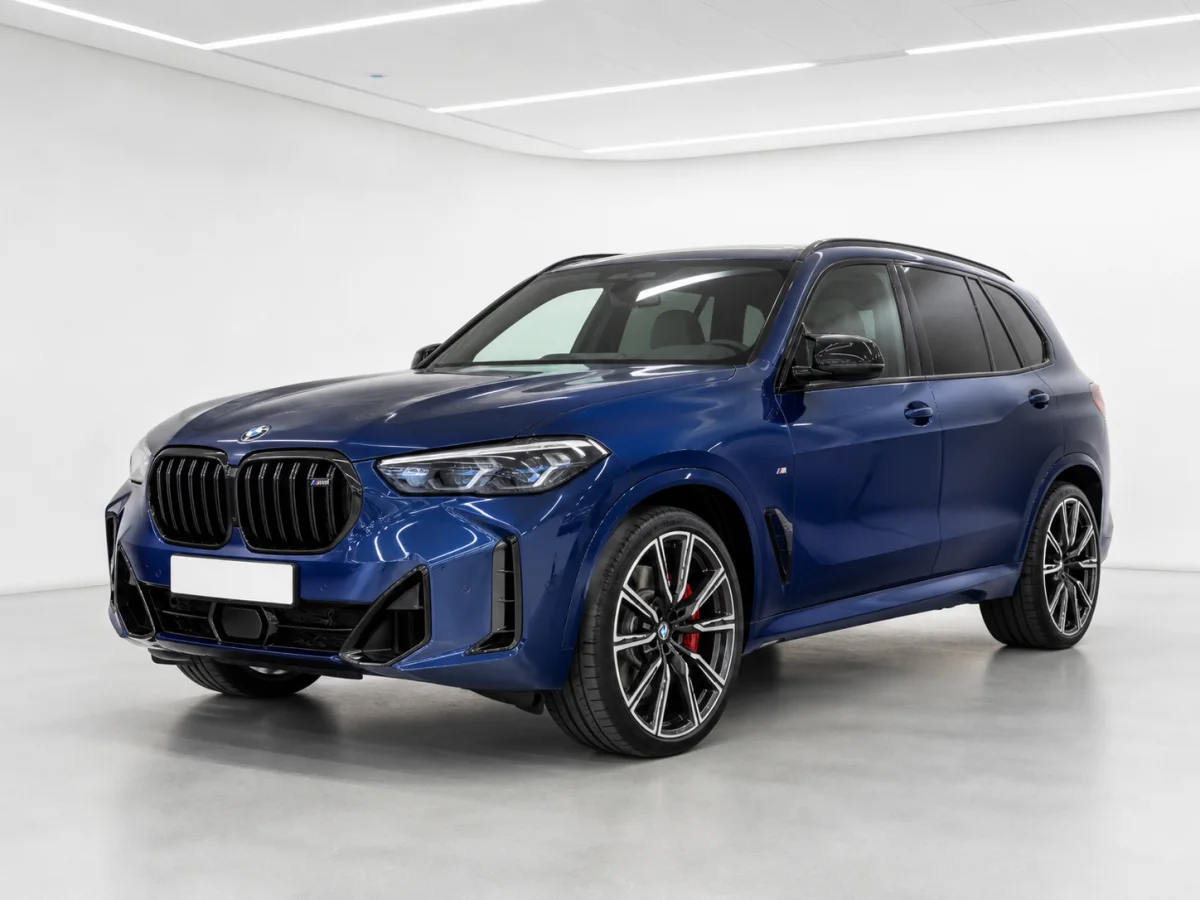 2026 BMW X5 M60i xDrive in a white LED showroom