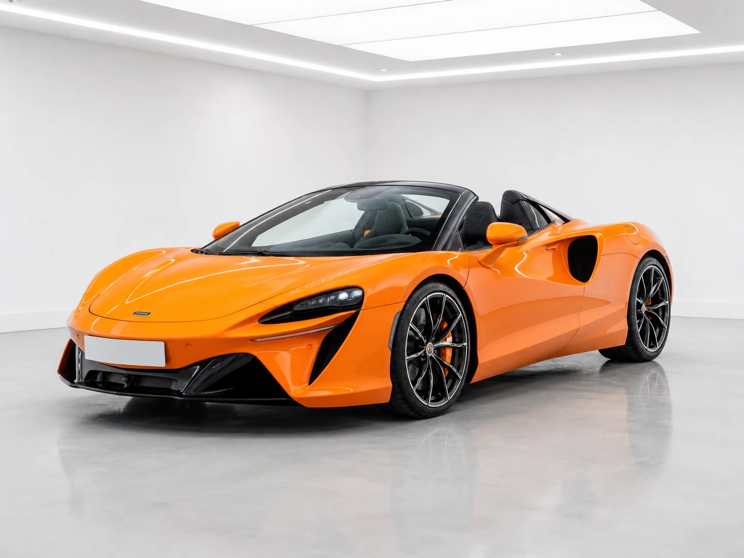 2026 McLaren Artura Spider in a white LED showroom