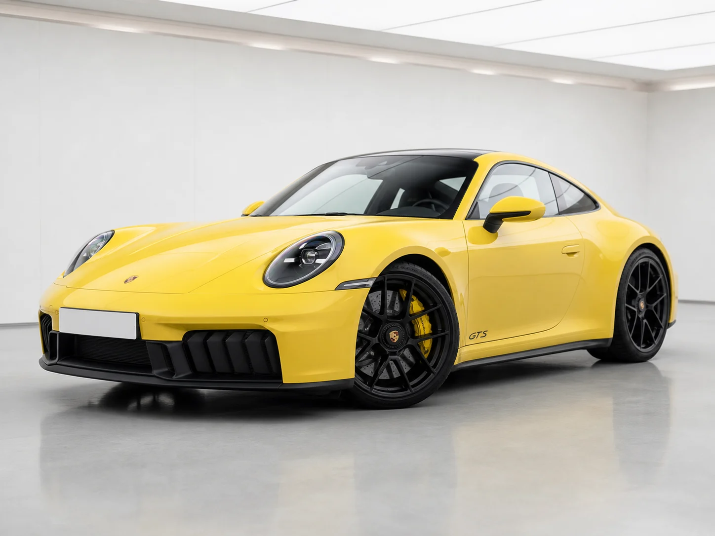 2026 Porsche 911 Carrera GTS T-Hybrid PDK in a white LED showroom