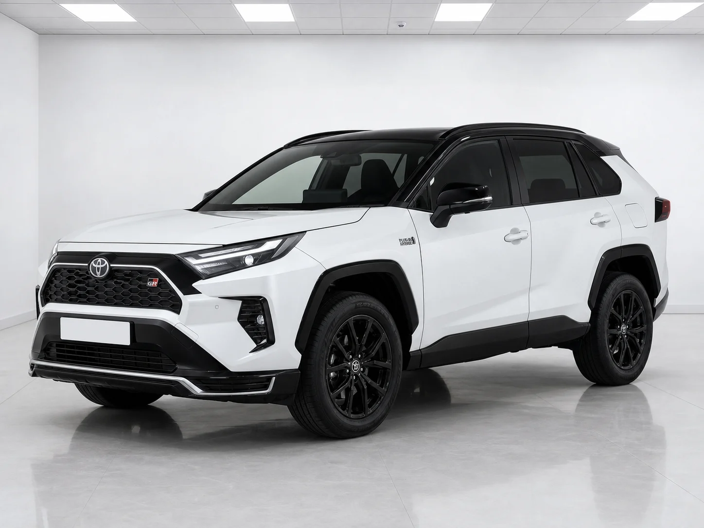 2026 Toyota RAV4 GR Sport Plug-in Hybrid AWD-i in a white LED showroom