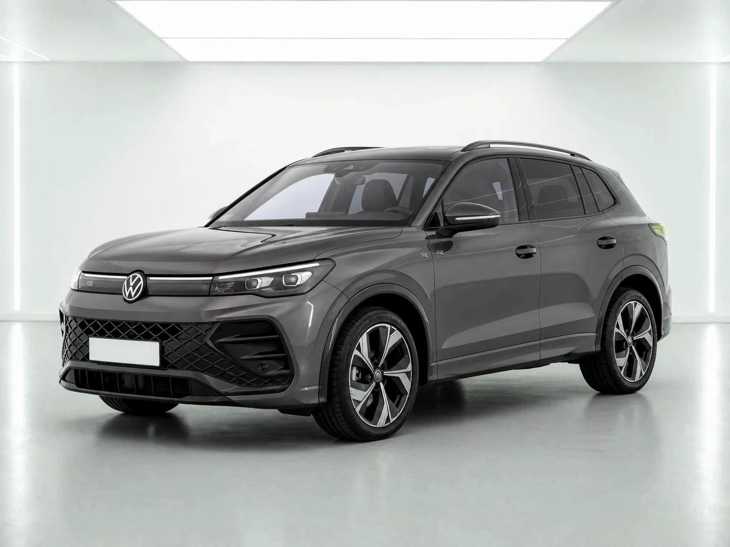2026 Volkswagen Tiguan R-Line eTSI in a white LED showroom
