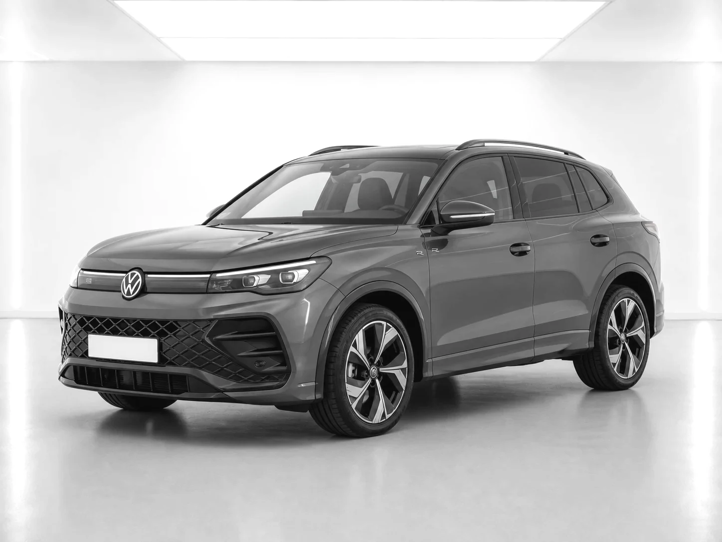 2026 Volkswagen Tiguan R-Line eTSI in a white LED showroom