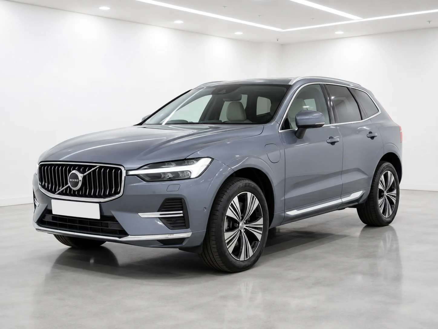 2026 Volvo XC60 T8 Plug-in Hybrid Ultra in a white LED showroom