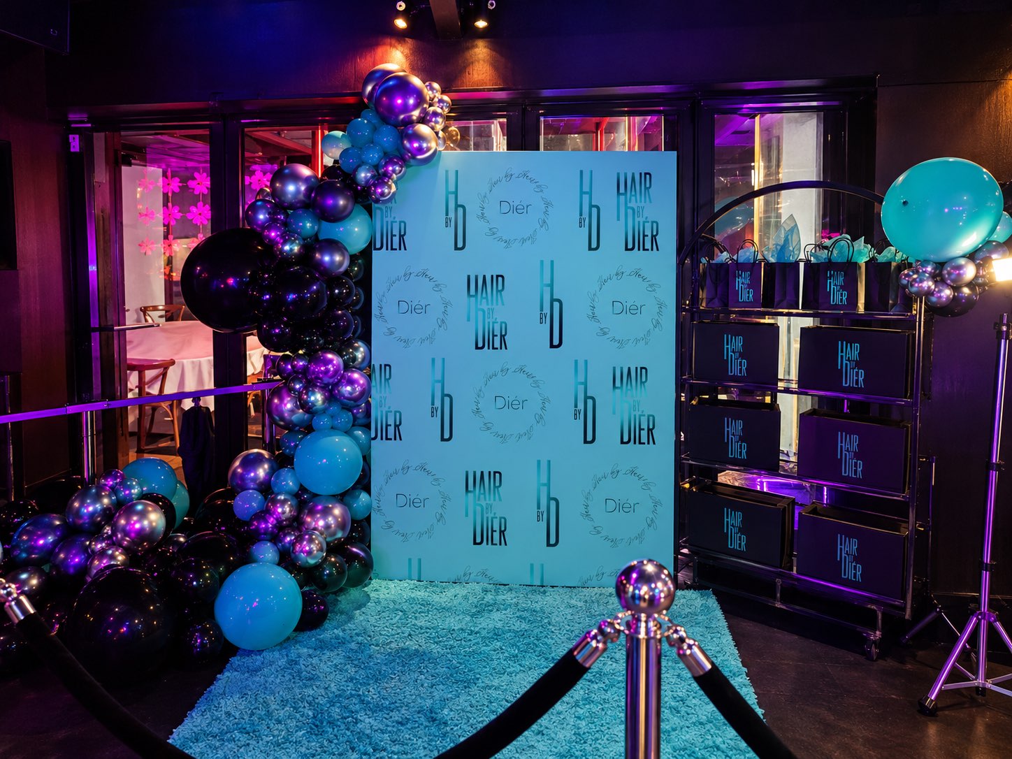 Turquoise event entrance with colourful balloons